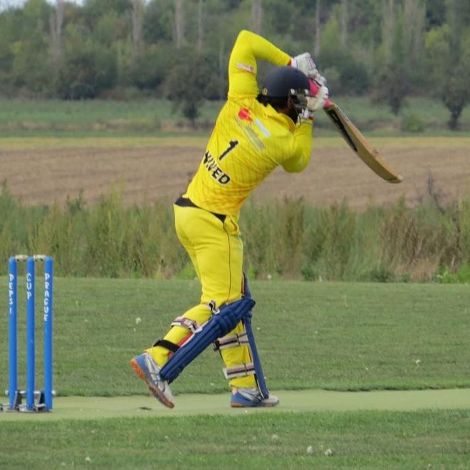 Batting, in pads and helmet