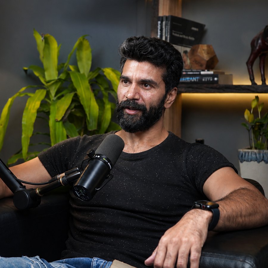 Recording the podcast, mic in front of him