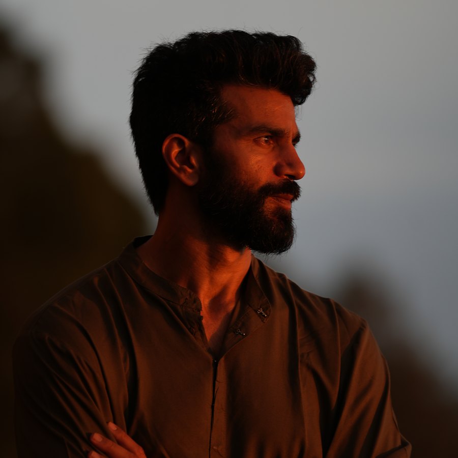 Nived Mishra at dusk, arms folded