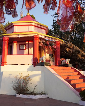 The Kasar Devi temple, prayer cloths in the trees